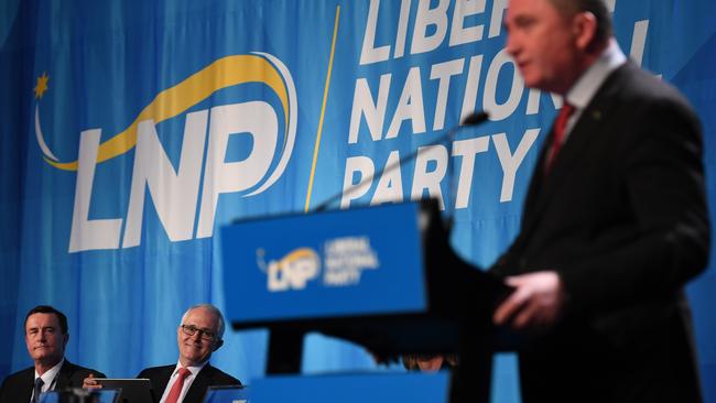 Malcolm Turnbull listens intently as his deputy Barnaby Joyce speaks at the Liberal National Party state conference in Brisbane last weekend. Photo: AAP