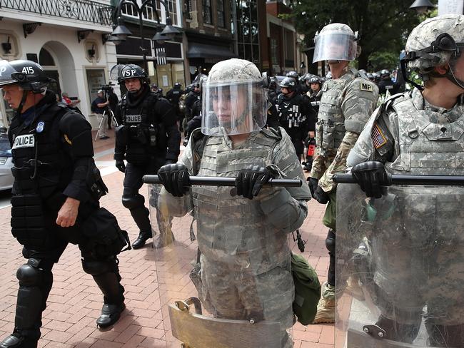 Police and members of the National Guard patrol near the scene. Picture: AFP