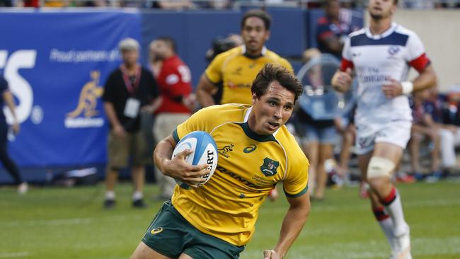 Australia’s Nick Phipps scores against the United States.