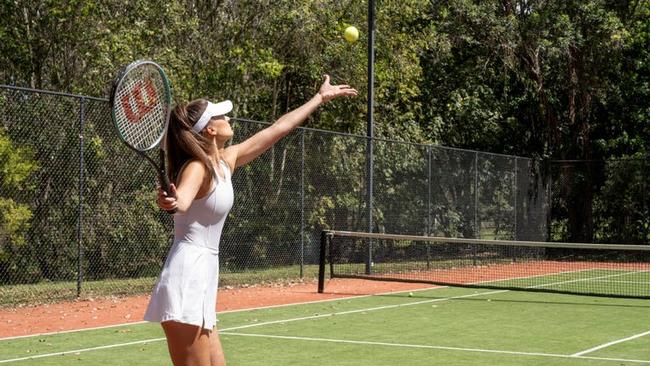 There’s a full size tennis court next to the main residence.