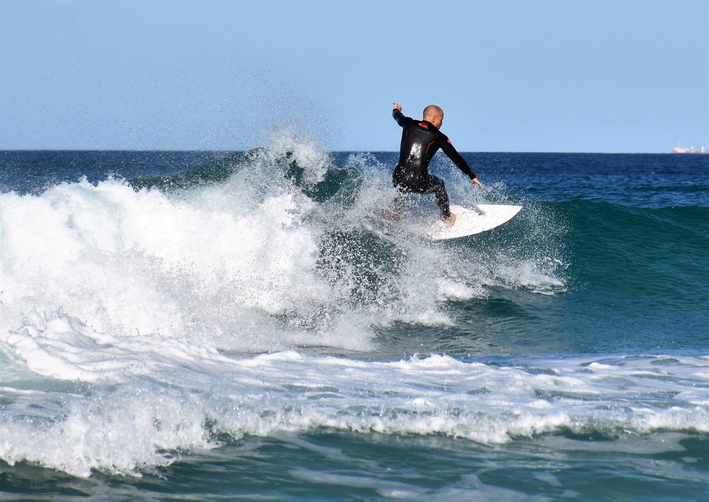 Surfers and bodyboard riders making the most of the waves at Kawana on the weekend. Picture: Mark Furler