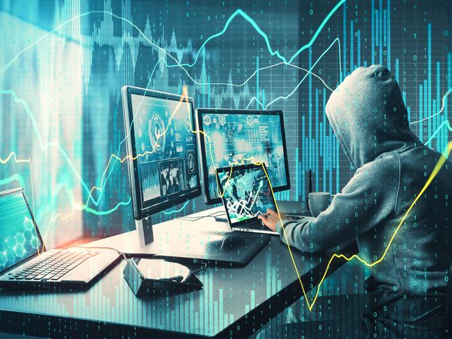 Side view of unrecognizable hacker at desktop using computers with forex chart on blurry office background. Malware and analysis concept. Double exposure