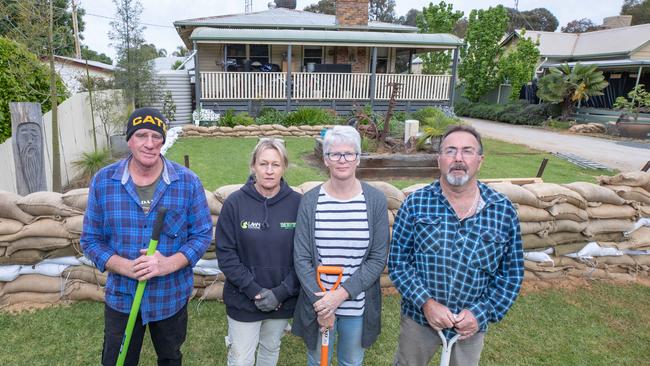 Myles and Jane Boal and Ronnie and Valerie Myers on Moama St, Echuca as they prepare for their pocket to go under. Picture: Jason Edwards