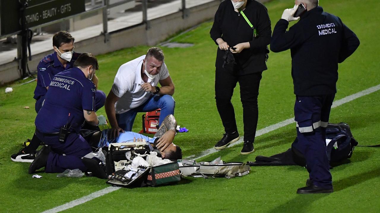 Andrew Fifita surrounded by medical staff. Photo: AAP Image/Darren England.