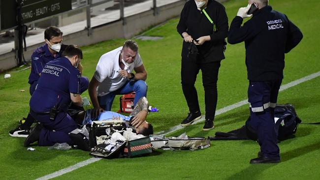 Andrew Fifita surrounded by medical staff. Photo: AAP Image/Darren England.