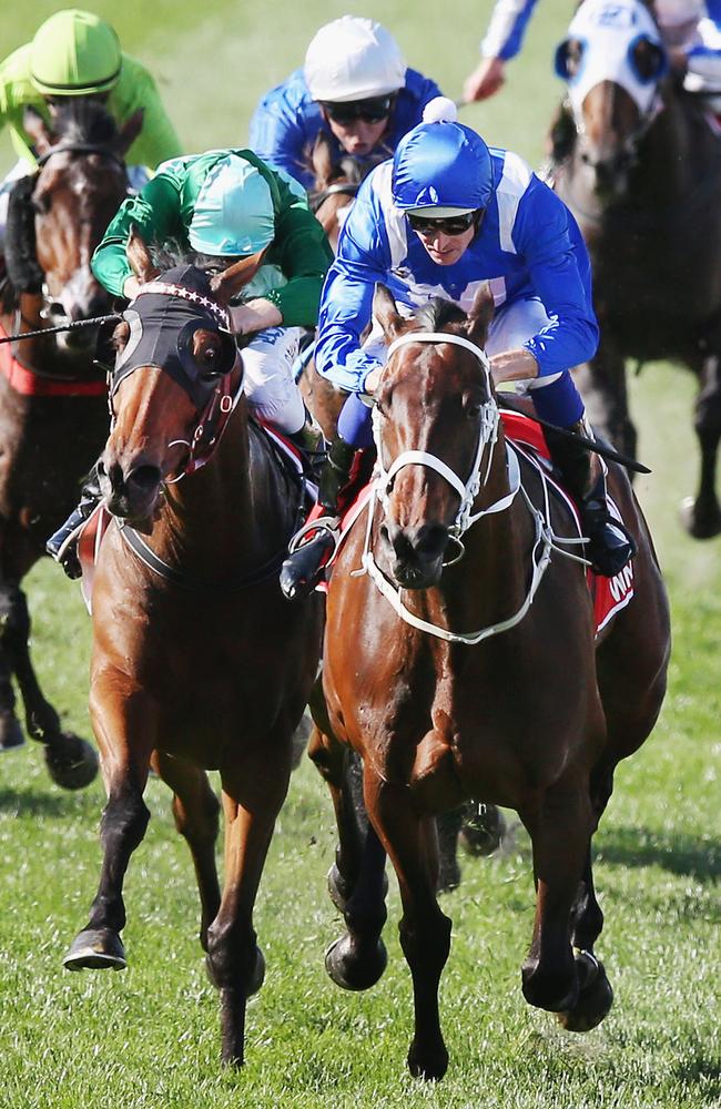 Winx, ridden by Hugh Bowman (blue cap), outguns Humidor to win last Saturday’s Cox Plate. Picture: Getty Images