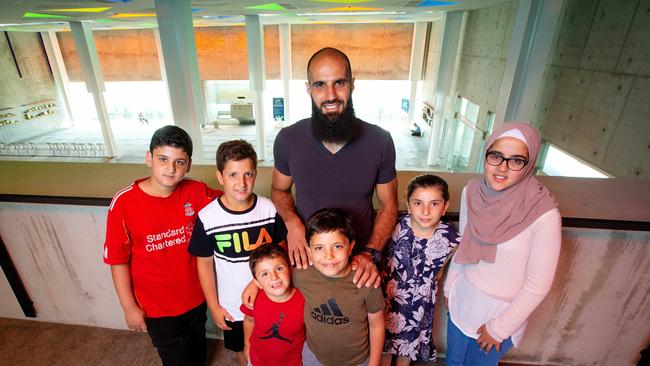 Bachar Houli, pictured at the Australian Islamic Centre with young fans, announces an $850,000 grant to build an interfaith centre at the site in Newport. Picture: Mark Stewart