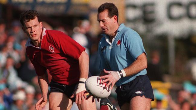 Jason Little (L) chases his Wallaby teammate David Campese (ball) in 1994.