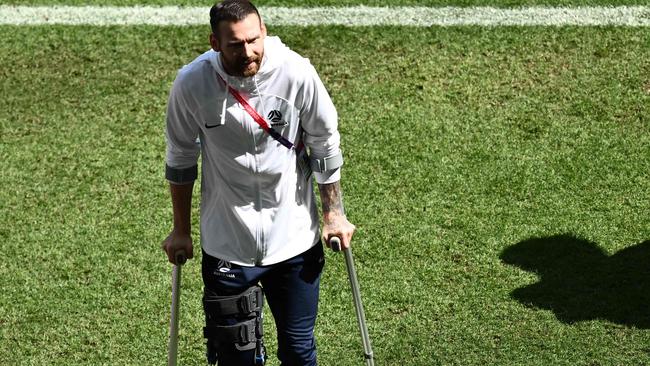 Australian midfielder Martin Boyle walks with crutches after last week’s ACL reconstruction.