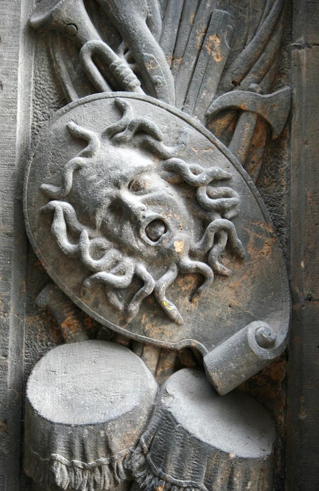 A depiction of the Ancient Greek Gorgon, Medusa. Staring upon her face resulted in turning into stone.