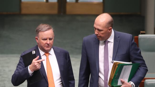 Question Time in the House of Representatives in Parliament House in Canberra. Anthony Albanese talks with Peter Dutton as they enter the chamber for Question Time. Picture Gary Ramage