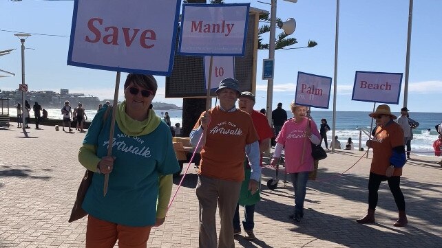 Protesters line Manly Beach on Sunday June 14 2020 in a bid to save the coastal walk arts trail. Picture: Madelaine Wong