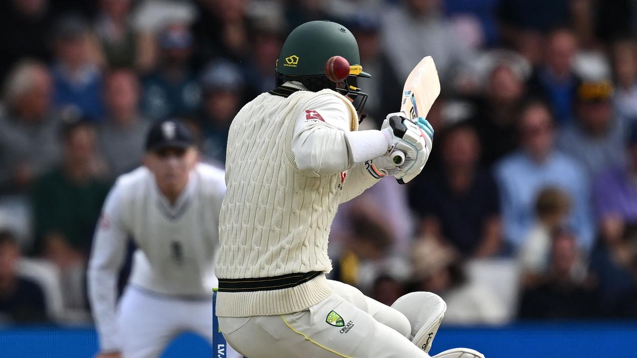 Australia's wicket keeper Alex Carey is hit on the helmet by a short ball. Picture: Getty