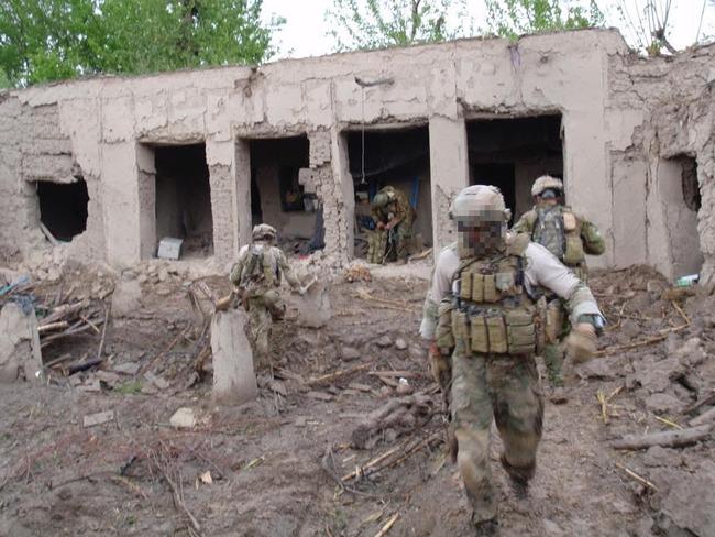 Whiskey 108, moments after a US air strike partially levelled the compound, in the SAS raid in 2009.