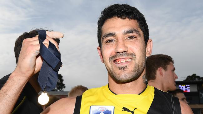 Marlion Pickett shows off his Norm Goss Medal after being best on ground in Richmond’s VFL premiership. Picture: Quinn Rooney/Getty Images.