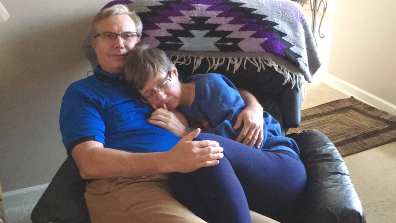 dementia-photo-of-husband-cuddling-wife-with-young-onset-is