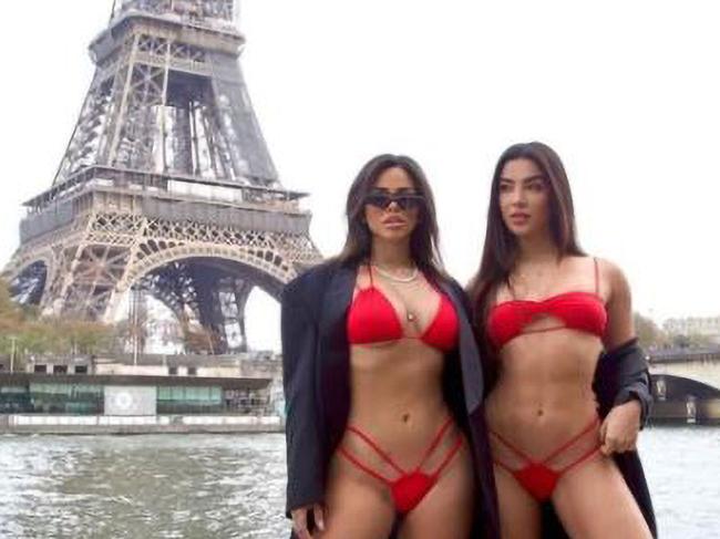Influencers Gabriela Versiani, Vanessa Lopes and Gabily approached by the police while taking bikini photos in front of the Eiffel Tower, in Paris France, undated. The police asked them to move and they went to another location. (CEN)