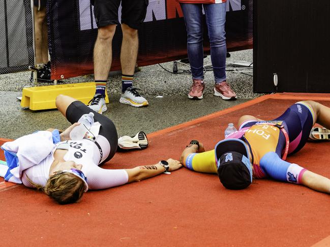 Triathletes Hanne De Vet and Penny Slater at the finish line of the Ironman 70.3 Tasmania in Hobart on Sunday 4th February 2024.Picture: Linda Higginson