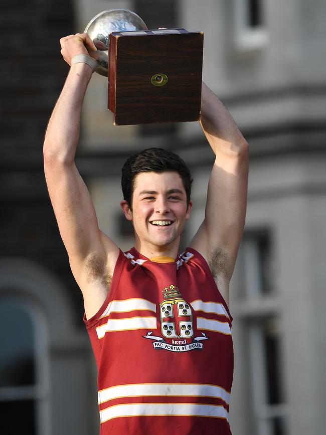 PAC skipper Karl Finlay celebrates after winning this year’s college football intercol against St Peter’s. Picture: AAP/Mark Brake