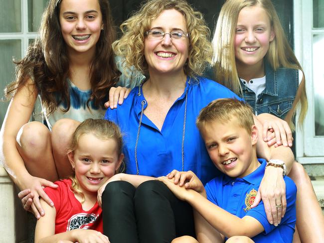 Debbie Rossi — pictured with her children (clockwise from front) Carina, seven, Alivia, 13, Sofia, 11 and Emidio, nine — left her mothers’ group in weeks. Picture: Janine Eastgate