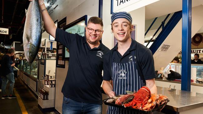 Alex Knoll and Kaelan Schofer with popular seafood over Easter at Angelakis Bros in the Adelaide Central Market. Picture: MATT LOXTON.