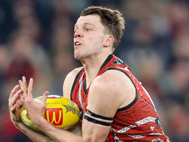 MELBOURNE, AUSTRALIA - MAY 25: Jordan Ridley of the Bombers marks the ball during the 2024 AFL Round 11 match between the Richmond Tigers and the Essendon Bombers at The Melbourne Cricket Ground on May 25, 2024 in Melbourne, Australia. (Photo by Dylan Burns/AFL Photos via Getty Images)