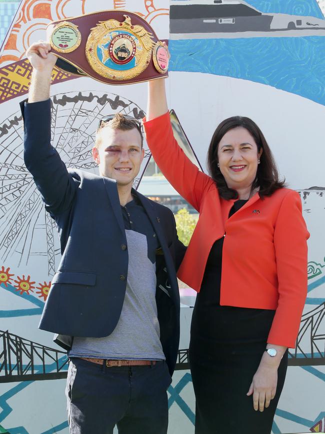 Jeff Horn with his WBO World Welterweight belt poses with Premier Annastacia Palaszczuk in 2017. Picture: Jono Searle/Getty Images