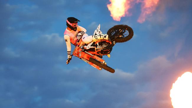 Chevy Olexienko jumps through the flames on his motocross bike at the 2024 Cairns Bull Throttle event, a bikes and bulls show, featuring bull riding and freestyle motocross riders at the Cairns Showgrounds last year. Picture: Brendan Radke