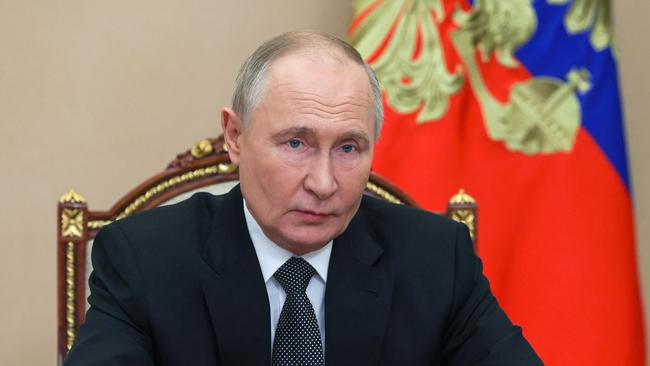 Russian President Vladimir Putin denies his country attempted to meddle in US politics. Picture: AFP