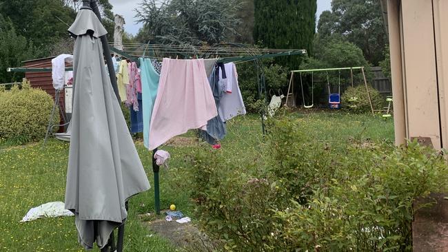 In the backyard of the home there is a child’s swing set and many pink toys including a scooter. Picture: Brianna Travers