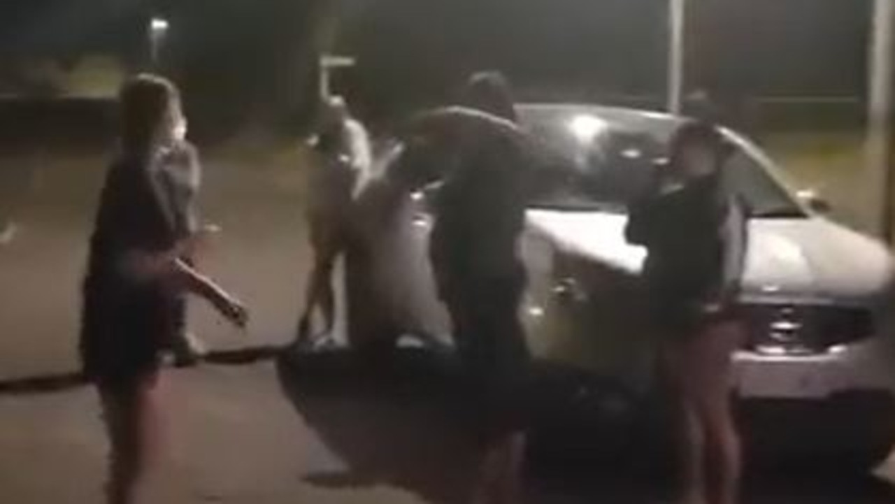 Women shape up for a fight on a Mount Isa street.
