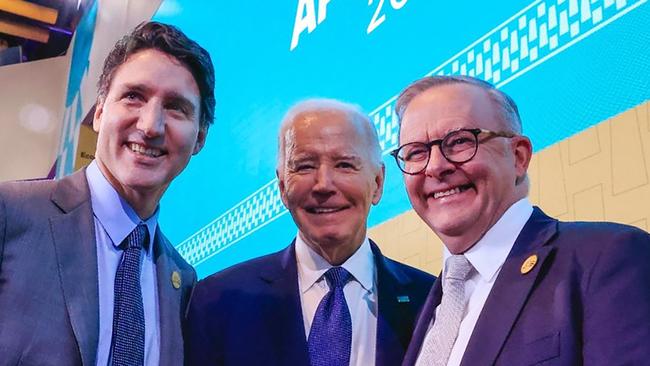 US President Joe Biden, centre, Canada's Prime Minster Justin Trudeau, left, and Prime Minister Anthony Albanese pose at the first gathering of APEC leaders in Peru.