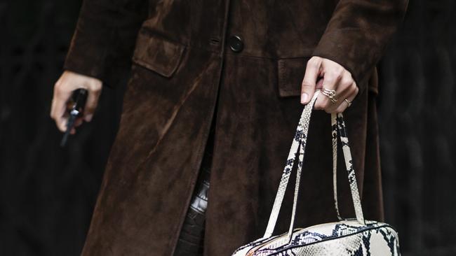 A snake-savvy guest in Paris at the Spring 2025 fashion shows. Photo: Daniel Zuchnik/Getty Images