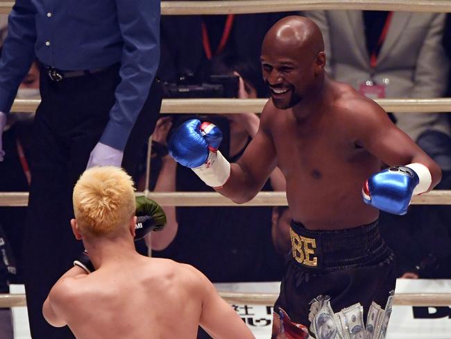 US boxing legend Floyd Mayweather Jr smiles during a New Year's Eve exhibition match against Japanese kickboxer Tenshin Nasukawa. Picture: AFP