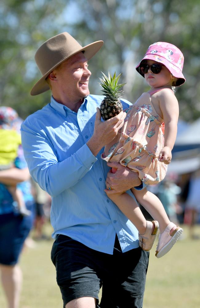 Rollingstone Pineapple Festival 2024. Casey Howard and Maggie, 2, compete in the pineapple race. Picture: Evan Morgan