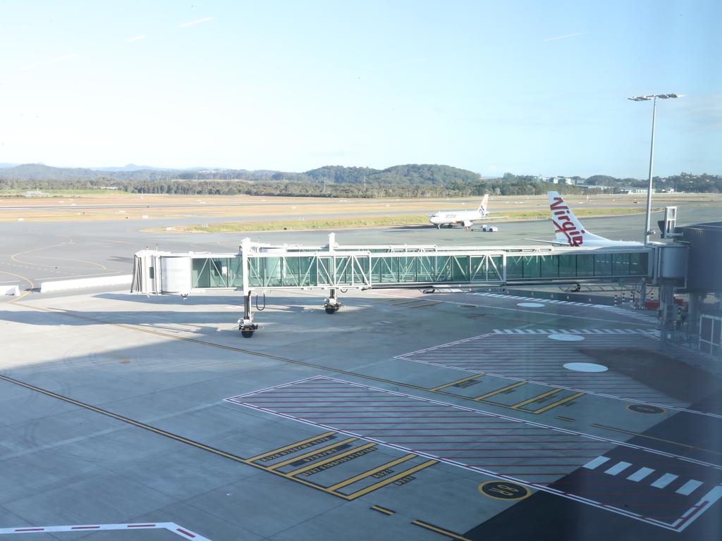 Aerobridges stretch out from the new terminal. Picture: Glenn Hampson.