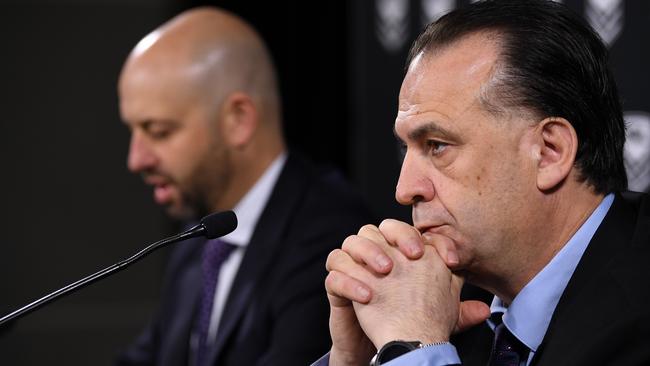 NRL CEO Todd Greenberg (left) and ARLC Chairman Peter V'landys speak to the media in Sydney, Sunday, March 15, 2020. (AAP Image/Joel Carrett) NO ARCHIVING