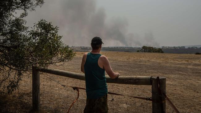 Nick Martlew fled as fire came within 20 meters of his property near Parndana on the Playford highway, Kangaroo Island. While fleeing his car broke down and was walking back to Pardana bare footed. PICTURE: Brad Fleet