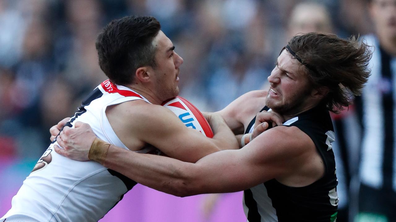 Rupert Wills tackles Jade Gresham at the MCG.