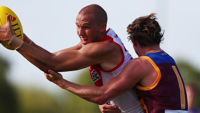 Sam Reid tries to break a Ben Keays tackle. Picture: Getty Images