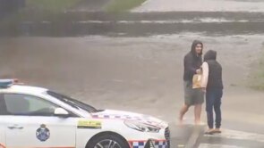 A man has ventured into floodwaters to retrieve the food he ordered online.