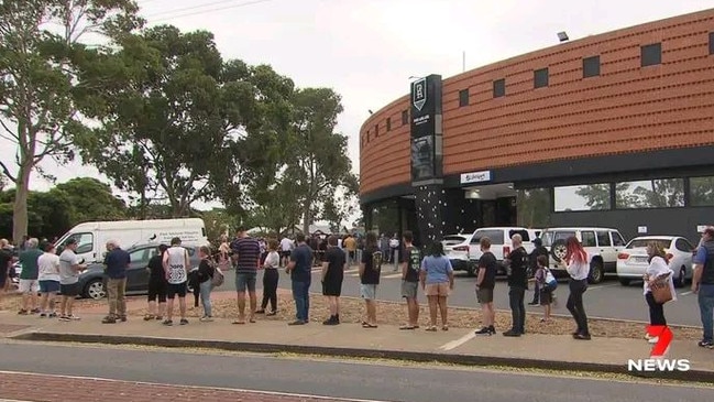 Port Adelaide fans line up to buy the Prison Bar jumper. Photo: Channel 7.