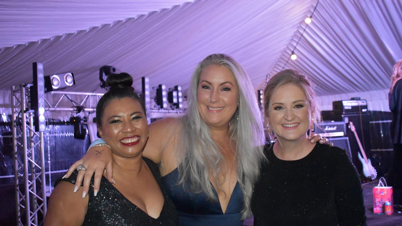 Former Proserpine Show Queens Tina West (1995), Jodi Lorraway (1997), and Sophie Camm (1996) enjoyed catching up at the 2021 Show Ball. Picture: Kirra Grimes.