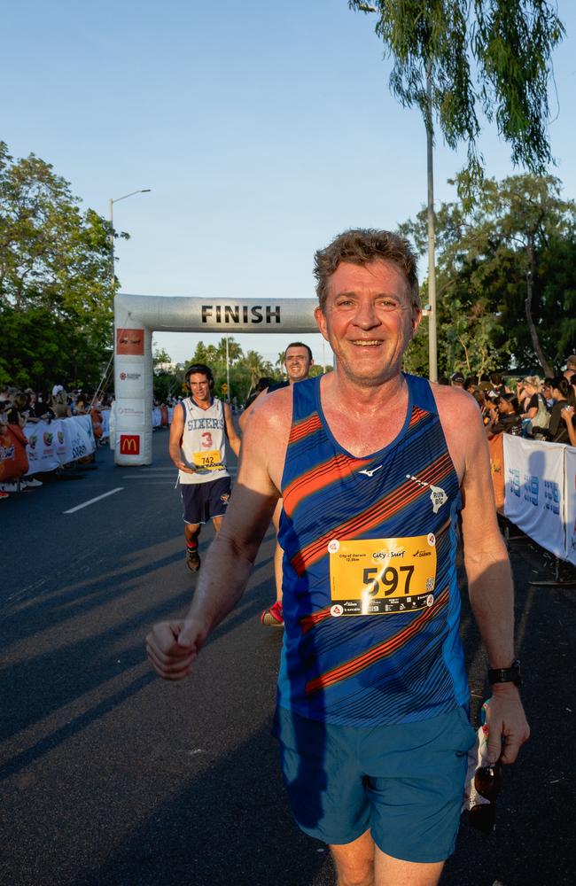 Simon Manzie crossing the finish line at the 2025 edition of the annual NT City2Surf, Sunday, June 1. Picture: Pema Tamang Pakhrin