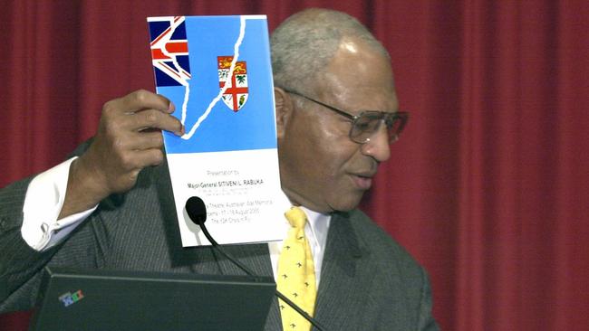 AUGUST 17, 2000 : Former Fijian PM General Sitivani Rabuka holds his book while at Australian War Memorial to address conference on South Paciffic defence issues, 17/08/00. Pic Michael Jones.P/