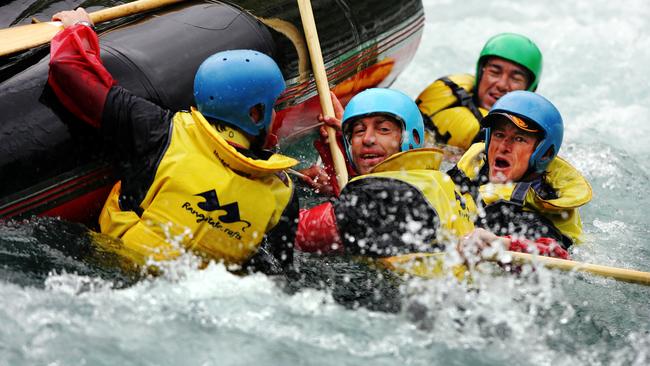 Coach Alastair Clarkson and assistant Damien Hardwick end up in the water during a rafting trip.