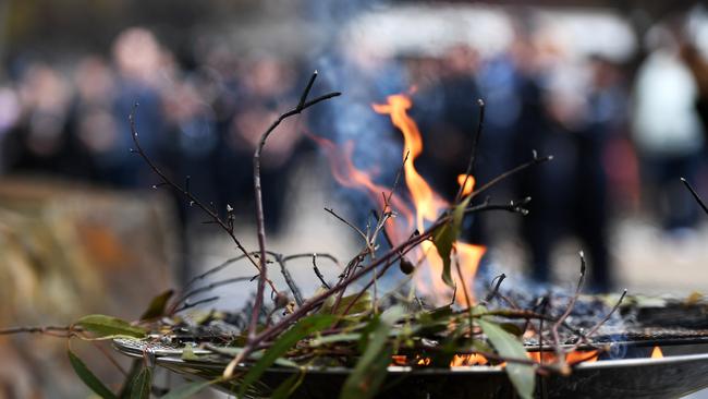 A smoking ceremony is held out the front of the South Australian Police Headquarters to launch National Reconciliation Week. Picture: NCA NewsWire / Tricia Watkinson