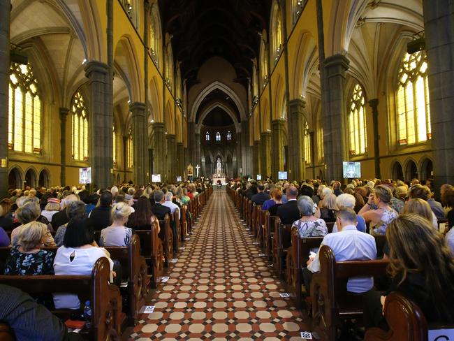 Mourners line the pews at St Patrick's Cathedral in East Melbourne. Picture: David Caird