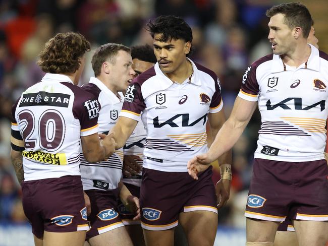 NEWCASTLE, AUSTRALIA - JULY 20: Brendan Piakura of the Broncos celebrates a try with team mates during the round 20 NRL match between Newcastle Knights and Brisbane Broncos at McDonald Jones Stadium, on July 20, 2024, in Newcastle, Australia. (Photo by Scott Gardiner/Getty Images)