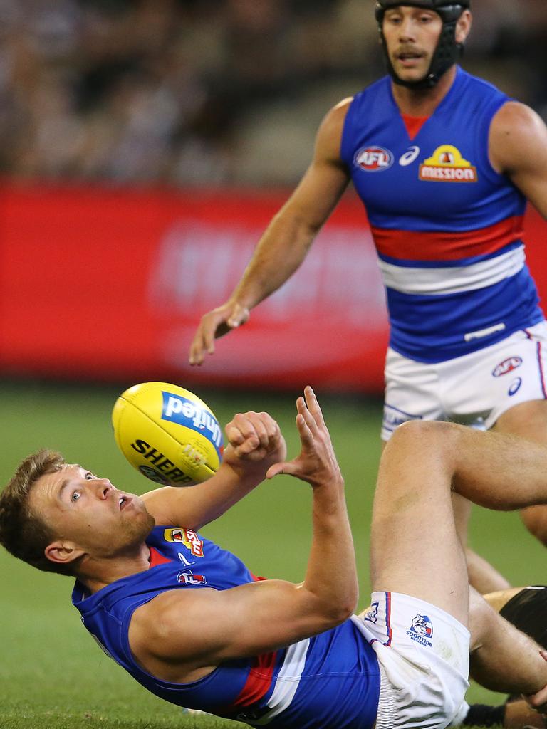 Bulldogs premiership players Jack Macrae (bottom) and Caleb Daniel have worked hard to win their spots back ahead of Friday night’s elimination final. Picture: Michael Klein.